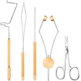 Five-piece stainless steel fly tying tools set including whip finisher knotter, bobbin holder, disc threader, arrow scissors, and winder threader